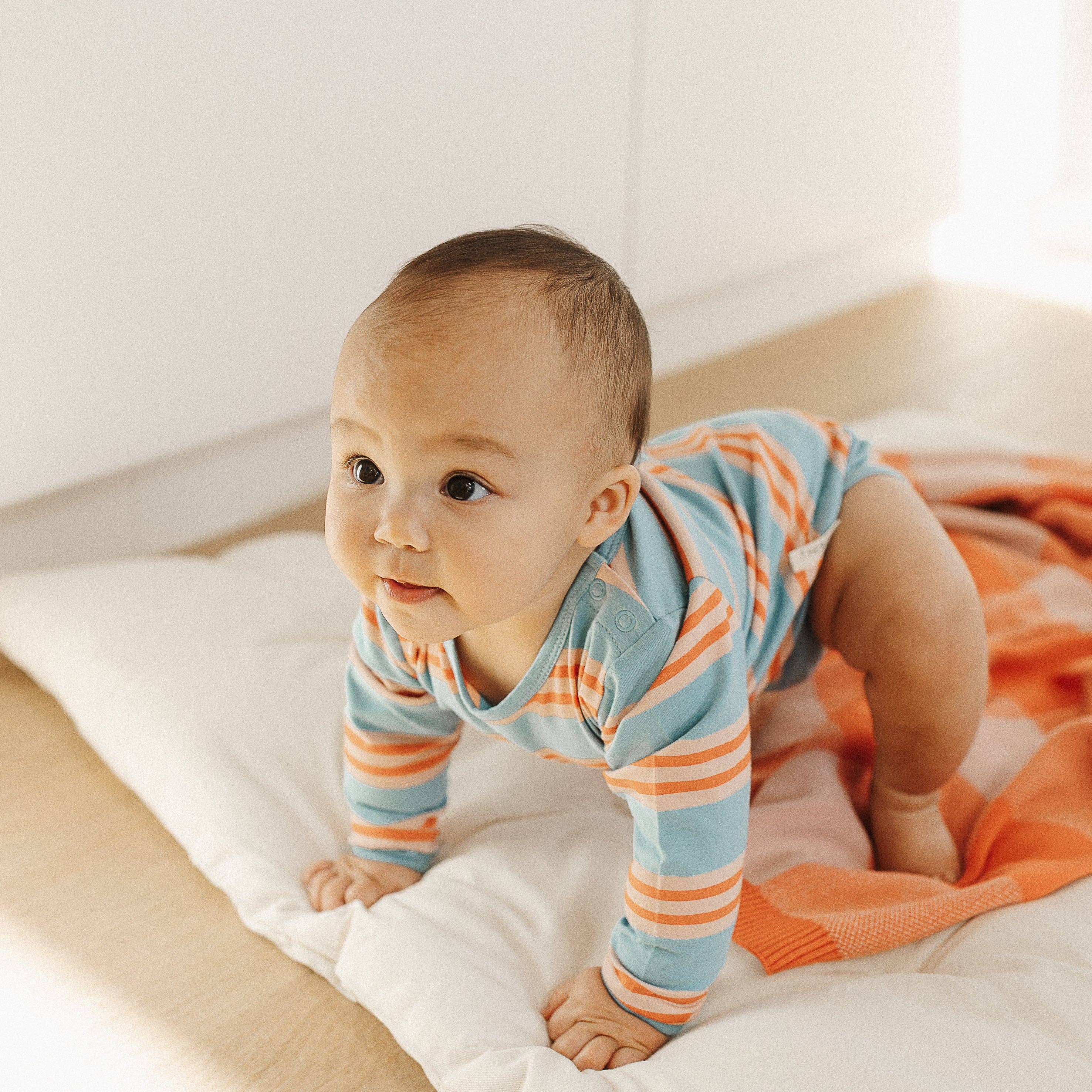 The Rest Bodysuit in Candy Stripe — styled lifestyle shot