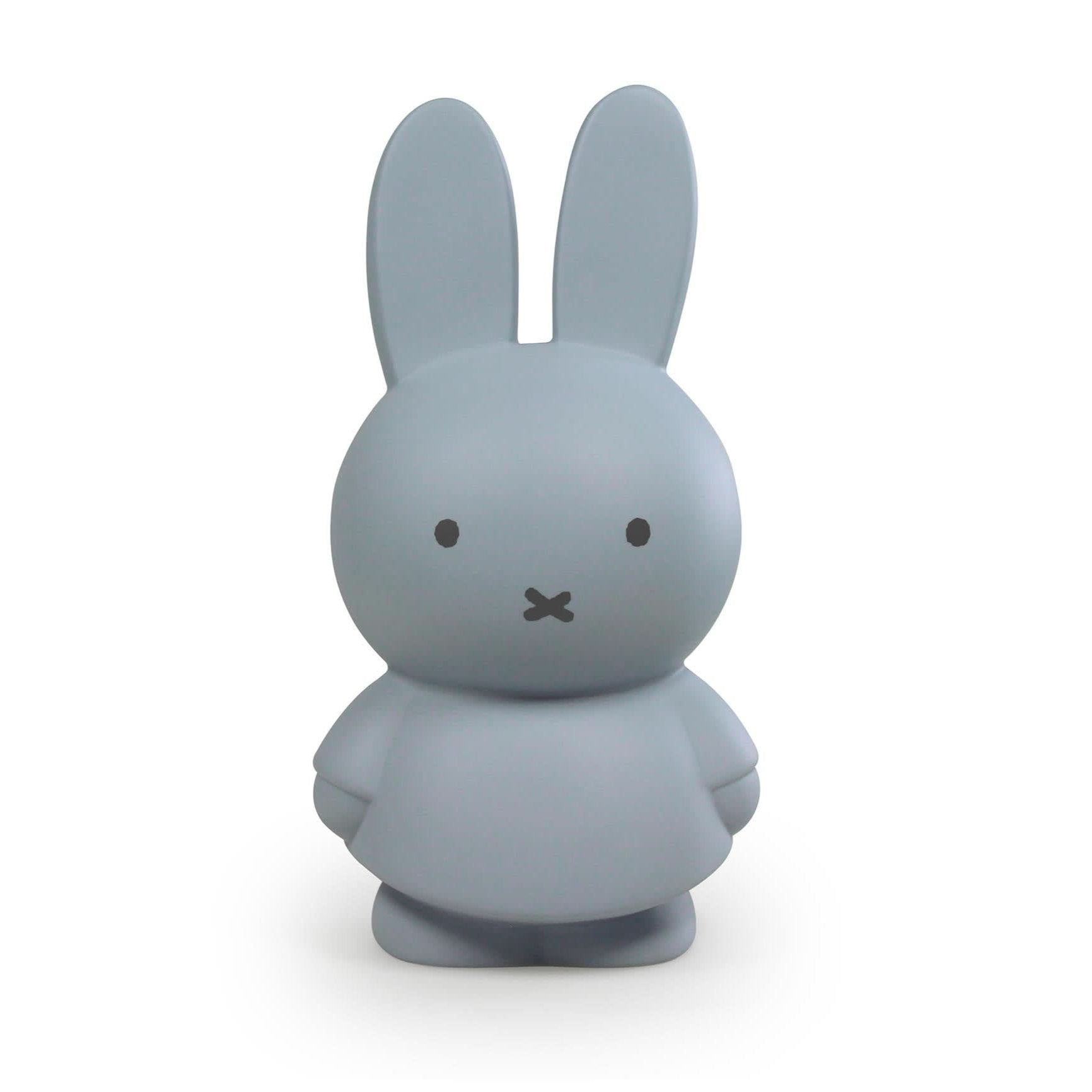 A blue money box designed to resemble a stylized bunny with a simple face and large ears.