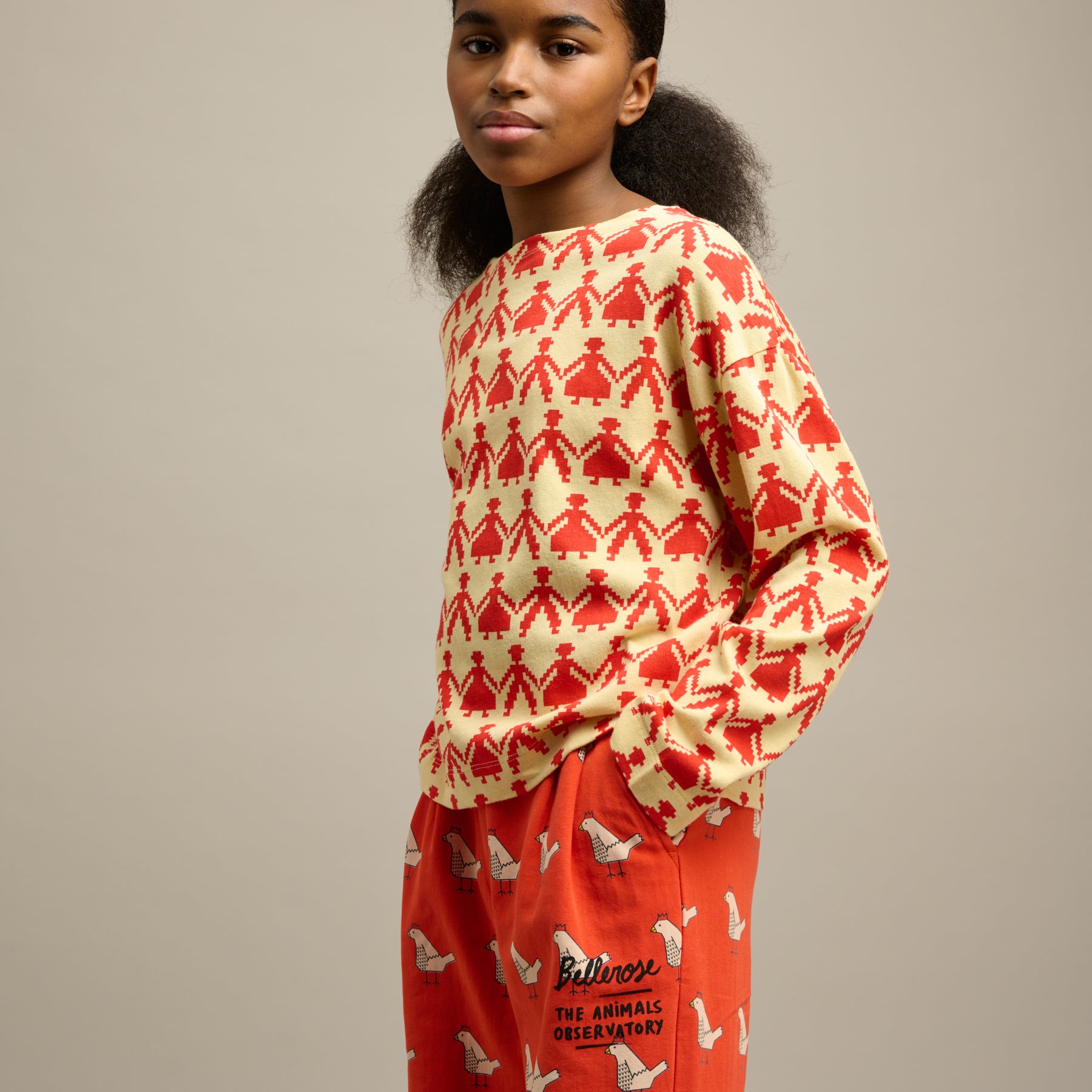 Girl wearing Bellerose X The Animals Observatory top with a pixel print