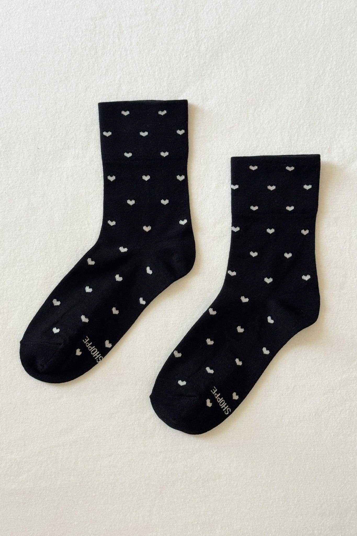Black and cream heart-print sneaker socks by Le Bon Shoppe