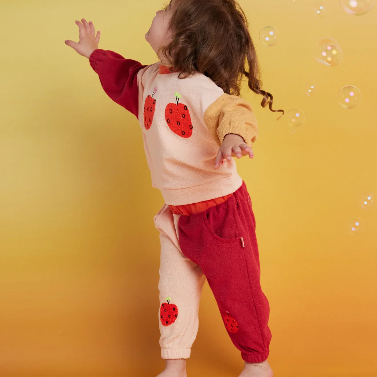 Halcyon Nights Terry Track Pant in Tiny Orchard — styled lifestyle shot