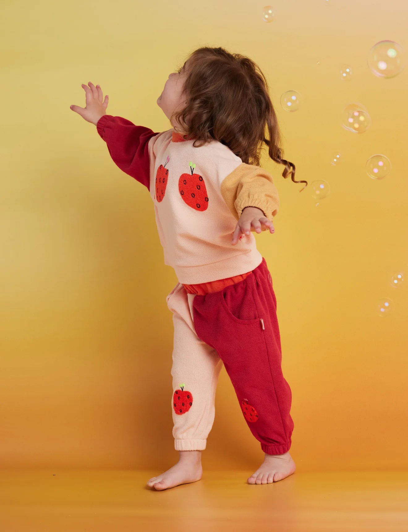 Halcyon Nights Terry Track Pant in Tiny Orchard — styled lifestyle shot